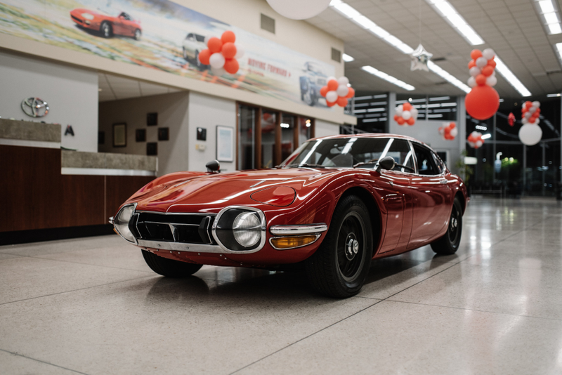 Illustration for article titled Hey, Let's Rob Some Banks To Buy This Perfect Left-Hand-Drive Toyota 2000GT